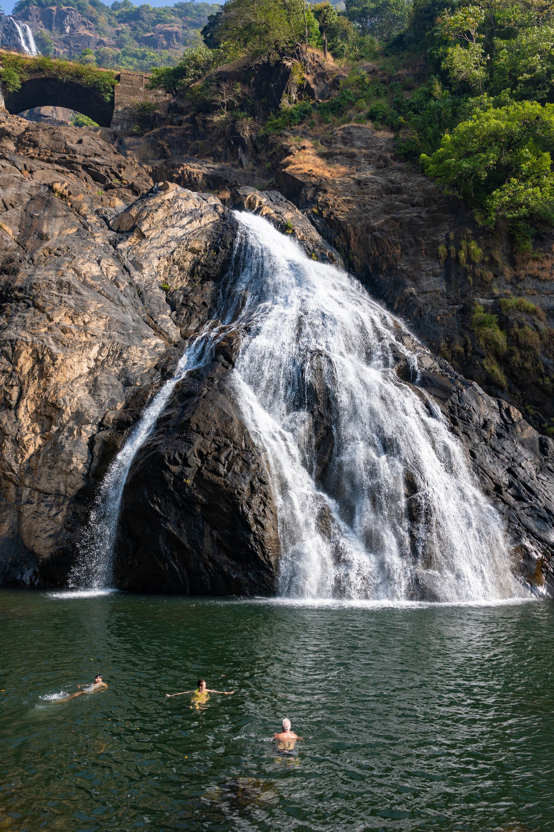 Waterfall And Swimmers